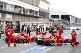 Fernando Alonso (ESP) Ferrari F2012 and team mate Felipe Massa (BRA) Ferrari F2012 in the pits. 08.06.2012. Formula 1 World Championship, Rd 7, Canadian Grand Prix, Montreal, Canada, Practice Day