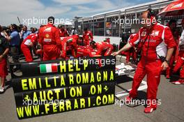Ferrari support earthquake victims on the grid. 10.06.2012. Formula 1 World Championship, Rd 7, Canadian Grand Prix, Montreal, Canada, Race Day