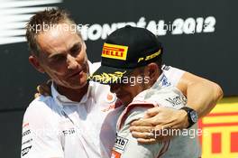 Race winner Lewis Hamilton (GBR) McLaren celebrates on the podium with Martin Whitmarsh (GBR) McLaren Chief Executive Officer. 10.06.2012. Formula 1 World Championship, Rd 7, Canadian Grand Prix, Montreal, Canada, Race Day