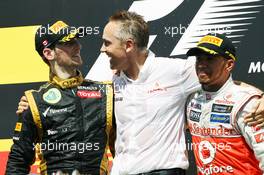 The podium (L to R): Romain Grosjean (FRA) Lotus F1 Team, second; Martin Whitmarsh (GBR) McLaren Chief Executive Officer; Lewis Hamilton (GBR) McLaren, race winner. 10.06.2012. Formula 1 World Championship, Rd 7, Canadian Grand Prix, Montreal, Canada, Race Day