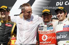 The podium (L to R): Romain Grosjean (FRA) Lotus F1 Team, second; Martin Whitmarsh (GBR) McLaren Chief Executive Officer; Lewis Hamilton (GBR) McLaren, race winner; Sergio Perez (MEX) Sauber, third. 10.06.2012. Formula 1 World Championship, Rd 7, Canadian Grand Prix, Montreal, Canada, Race Day