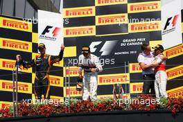 The podium (L to R): Romain Grosjean (FRA) Lotus F1 Team, second; Sergio Perez (MEX) Sauber, third; Martin Whitmarsh (GBR) McLaren Chief Executive Officer; Lewis Hamilton (GBR) McLaren, race winner. 10.06.2012. Formula 1 World Championship, Rd 7, Canadian Grand Prix, Montreal, Canada, Race Day