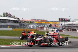 Lewis Hamilton (GBR) McLaren MP4/27 leads Fernando Alonso (ESP) Ferrari F2012 and Sebastian Vettel (GER) Red Bull Racing RB8. 10.06.2012. Formula 1 World Championship, Rd 7, Canadian Grand Prix, Montreal, Canada, Race Day