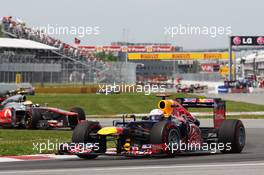 Sebastian Vettel (GER) Red Bull Racing RB8 leads Fernando Alonso (ESP) Ferrari F2012. 10.06.2012. Formula 1 World Championship, Rd 7, Canadian Grand Prix, Montreal, Canada, Race Day
