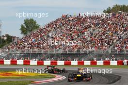 Mark Webber (AUS) Red Bull Racing RB8 leads Romain Grosjean (FRA) Lotus F1 E20. 10.06.2012. Formula 1 World Championship, Rd 7, Canadian Grand Prix, Montreal, Canada, Race Day