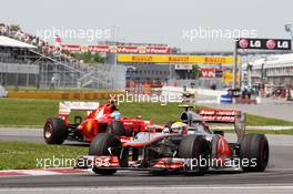 Lewis Hamilton (GBR) McLaren MP4/27 leads Fernando Alonso (ESP) Ferrari F2012. 10.06.2012. Formula 1 World Championship, Rd 7, Canadian Grand Prix, Montreal, Canada, Race Day