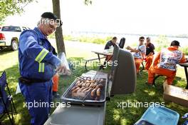 Marshalls enjoy a barbecue. 09.06.2012. Formula 1 World Championship, Rd 7, Canadian Grand Prix, Montreal, Canada, Qualifying Day
