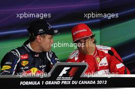 (L to R): pole sitter Sebastian Vettel (GER) Red Bull Racing and Fernando Alonso (ESP) Ferrari in the FIA Press Conference. 09.06.2012. Formula 1 World Championship, Rd 7, Canadian Grand Prix, Montreal, Canada, Qualifying Day