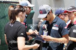 Daniel Ricciardo (AUS) Scuderia Toro Rosso signs autographs for the fans. 10.06.2012. Formula 1 World Championship, Rd 7, Canadian Grand Prix, Montreal, Canada, Race Day