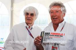 Mario Andretti (USA) (Centre) presenting a VIP ticket for the 2012 United States Grand Prix to Bernie Ecclestone (GBR) CEO Formula One Group (FOM) (Left). 10.06.2012. Formula 1 World Championship, Rd 7, Canadian Grand Prix, Montreal, Canada, Race Day