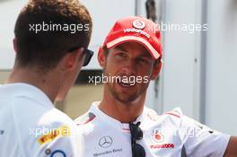 (L to R): Paul di Resta (GBR) Sahara Force India F1 talks with Jenson Button (GBR) McLaren. 07.06.2012. Formula 1 World Championship, Rd 7, Canadian Grand Prix, Montreal, Canada, Preparation Day