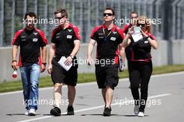 Timo Glock (GER) Marussia F1 Team (Left) and Maria De Villota (ESP) Marussia F1 Team Test Driver (Right) walk the circuit. 07.06.2012. Formula 1 World Championship, Rd 7, Canadian Grand Prix, Montreal, Canada, Preparation Day