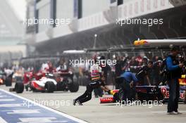 Lewis Hamilton (GBR) McLaren MP4/27 and a Red Bull Racing RB8 in the pits. 13.04.2012. Formula 1 World Championship, Rd 3, Chinese Grand Prix, Shanghai, China, Practice Day