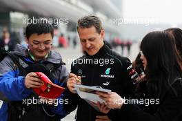 Michael Schumacher (GER) Mercedes AMG F1 signs autographs for the fans. 13.04.2012. Formula 1 World Championship, Rd 3, Chinese Grand Prix, Shanghai, China, Practice Day