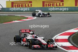 Jenson Button (GBR) McLaren MP4/27 leads Kamui Kobayashi (JPN) Sauber C31. 13.04.2012. Formula 1 World Championship, Rd 3, Chinese Grand Prix, Shanghai, China, Practice Day