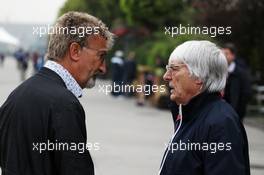 (L to R): Eddie Jordan (IRE) BBC Television Pundit talks with Bernie Ecclestone (GBR) CEO Formula One Group (FOM). 13.04.2012. Formula 1 World Championship, Rd 3, Chinese Grand Prix, Shanghai, China, Practice Day