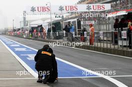 Pirelli tyre technician takes a track reading. 13.04.2012. Formula 1 World Championship, Rd 3, Chinese Grand Prix, Shanghai, China, Practice Day