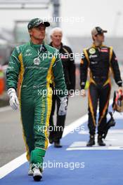 Heikki Kovalainen (FIN) Caterham and Romain Grosjean (FRA) Lotus F1 Team. 13.04.2012. Formula 1 World Championship, Rd 3, Chinese Grand Prix, Shanghai, China, Practice Day