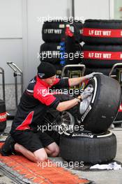 Marussia F1 Team wash Pirelli tyres. 13.04.2012. Formula 1 World Championship, Rd 3, Chinese Grand Prix, Shanghai, China, Practice Day