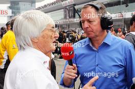 (L to R): Bernie Ecclestone (GBR) CEO Formula One Group (FOM) with Martin Brundle (GBR) Sky Sports Commentator on the grid. 15.04.2012. Formula 1 World Championship, Rd 3, Chinese Grand Prix, Shanghai, China, Race Day