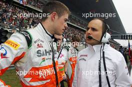 (L to R): Paul di Resta (GBR) Sahara Force India F1 with Gianpiero Lambiase (ITA) Sahara Force India F1 Engineer on the grid. 15.04.2012. Formula 1 World Championship, Rd 3, Chinese Grand Prix, Shanghai, China, Race Day