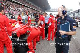 Adrian Newey (GBR) Red Bull Racing Chief Technical Officer looks at the Ferrari F2012 on the grid. 15.04.2012. Formula 1 World Championship, Rd 3, Chinese Grand Prix, Shanghai, China, Race Day