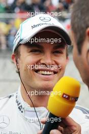 Nico Rosberg (GER) Mercedes AMG F1 with Kai Ebel (GER) RTL TV Presenter on the grid. 15.04.2012. Formula 1 World Championship, Rd 3, Chinese Grand Prix, Shanghai, China, Race Day