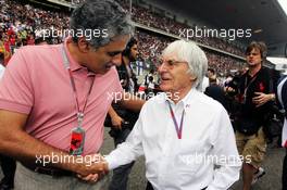 (L to R): Zayed Al Zayani, Chairman Bahrain International Circuit (BRN) with Bernie Ecclestone (GBR) CEO Formula One Group (FOM) on the grid. 15.04.2012. Formula 1 World Championship, Rd 3, Chinese Grand Prix, Shanghai, China, Race Day