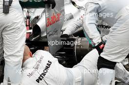 Mercedes AMG F1 W03 of pole sitter and race winner Nico Rosberg (GER) Mercedes AMG F1 worked on by mechanics on the grid. 15.04.2012. Formula 1 World Championship, Rd 3, Chinese Grand Prix, Shanghai, China, Race Day