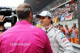 Nico Rosberg (GER) Mercedes AMG F1 with Kai Ebel (GER) RTL TV Presenter on the grid. 15.04.2012. Formula 1 World Championship, Rd 3, Chinese Grand Prix, Shanghai, China, Race Day