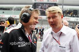 (L to R): Dr. Aki Hintsa (FIN) McLaren Team Doctor with Mika Hakkinen (FIN) on the grid. 15.04.2012. Formula 1 World Championship, Rd 3, Chinese Grand Prix, Shanghai, China, Race Day