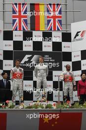 2nd place Jenson Button (GBR) McLaren wtih 1st place Nico Rosberg (GER), Mercedes AMG Petronas and 3rd place Lewis Hamilton (GBR), McLaren Mercedes  15.04.2012. Formula 1 World Championship, Rd 3, Chinese Grand Prix, Shanghai, China, Race Day