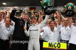 Race winner Nico Rosberg (GER) Mercedes AMG F1 celebrates with Ross Brawn (GBR) Mercedes AMG F1 Team Principal; Sam Bird (GBR) Mercedes AMG F1 Test And Reserve Driver and the rest of the team. 15.04.2012. Formula 1 World Championship, Rd 3, Chinese Grand Prix, Shanghai, China, Race Day