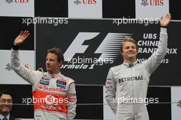 2nd place Jenson Button (GBR), McLaren Mercedes with 1st place Nico Rosberg (GER), Mercedes AMG Petronas  15.04.2012. Formula 1 World Championship, Rd 3, Chinese Grand Prix, Shanghai, China, Race Day