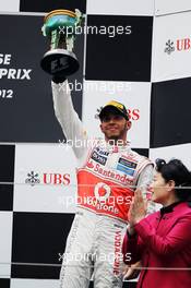 Lewis Hamilton (GBR) McLaren celebrates his third position on the podium. 15.04.2012. Formula 1 World Championship, Rd 3, Chinese Grand Prix, Shanghai, China, Race Day