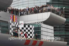 The podium (L to R): Jenson Button (GBR) McLaren, second; Nico Rosberg (GER) Mercedes AMG F1, race winner; Lewis Hamilton (GBR) McLaren, third; Norbert Haug (GER) Mercedes Sporting Director. 15.04.2012. Formula 1 World Championship, Rd 3, Chinese Grand Prix, Shanghai, China, Race Day