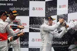 The podium (L to R): Jenson Button (GBR) McLaren; Lewis Hamilton (GBR) McLaren and race winner Nico Rosberg (GER) Mercedes AMG F1 spray Norbert Haug (GER) Mercedes Sporting Director on the podium. 15.04.2012. Formula 1 World Championship, Rd 3, Chinese Grand Prix, Shanghai, China, Race Day