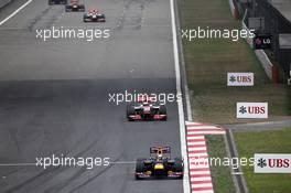 Sebastian Vettel (GER) Red Bull Racing RB8 leads Jenson Button (GBR) McLaren MP4/27. 15.04.2012. Formula 1 World Championship, Rd 3, Chinese Grand Prix, Shanghai, China, Race Day