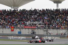 Lewis Hamilton (GBR) McLaren MP4/27 leads Sergio Perez (MEX) Sauber C31 and Kamui Kobayashi (JPN) Sauber C31. 15.04.2012. Formula 1 World Championship, Rd 3, Chinese Grand Prix, Shanghai, China, Race Day