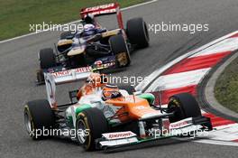 Nico Hulkenberg (GER) Sahara Force India F1 VJM05 leads Daniel Ricciardo (AUS) Scuderia Toro Rosso STR7. 15.04.2012. Formula 1 World Championship, Rd 3, Chinese Grand Prix, Shanghai, China, Race Day