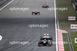 Kimi Raikkonen (FIN) Lotus E20 leads Paul di Resta (GBR) Sahara Force India VJM05. 15.04.2012. Formula 1 World Championship, Rd 3, Chinese Grand Prix, Shanghai, China, Race Day