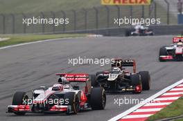 Jenson Button (GBR) McLaren MP4/27 leads Heikki Kovalainen (FIN) Caterham CT01. 15.04.2012. Formula 1 World Championship, Rd 3, Chinese Grand Prix, Shanghai, China, Race Day