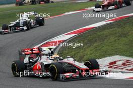 Lewis Hamilton (GBR) McLaren MP4/27 leads Kamui Kobayashi (JPN) Sauber C31. 15.04.2012. Formula 1 World Championship, Rd 3, Chinese Grand Prix, Shanghai, China, Race Day