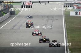 Kimi Raikkonen (FIN) Lotus E20 leads Sebastian Vettel (GER) Red Bull Racing RB8. 15.04.2012. Formula 1 World Championship, Rd 3, Chinese Grand Prix, Shanghai, China, Race Day