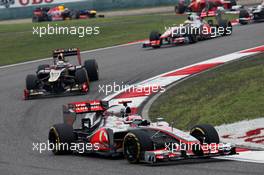 Jenson Button (GBR) McLaren MP4/27 leads Kimi Raikkonen (FIN) Lotus E20. 15.04.2012. Formula 1 World Championship, Rd 3, Chinese Grand Prix, Shanghai, China, Race Day