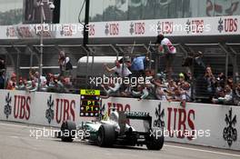 Race winner Nico Rosberg (GER) Mercedes AMG F1 W03 celebrates as he passes his team at the end of the race. 15.04.2012. Formula 1 World Championship, Rd 3, Chinese Grand Prix, Shanghai, China, Race Day