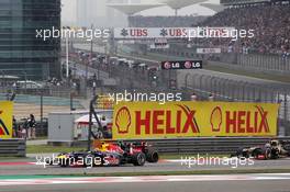 Lewis Hamilton (GBR) McLaren MP4/27  battles for position with Mark Webber (AUS) Red Bull Racing RB8 and Kimi Raikkonen (FIN) Lotus E20. 15.04.2012. Formula 1 World Championship, Rd 3, Chinese Grand Prix, Shanghai, China, Race Day