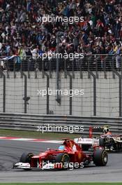 Fernando Alonso (ESP) Ferrari F2012 leads Romain Grosjean (FRA) Lotus F1 E20. 15.04.2012. Formula 1 World Championship, Rd 3, Chinese Grand Prix, Shanghai, China, Race Day