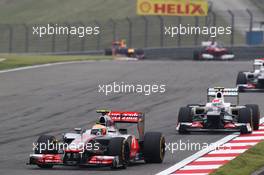 Lewis Hamilton (GBR) McLaren MP4/27 leads Sergio Perez (MEX) Sauber C31. 15.04.2012. Formula 1 World Championship, Rd 3, Chinese Grand Prix, Shanghai, China, Race Day