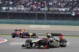 Romain Grosjean (FRA) Lotus F1 E20 leads Sebastian Vettel (GER) Red Bull Racing RB8. 15.04.2012. Formula 1 World Championship, Rd 3, Chinese Grand Prix, Shanghai, China, Race Day
